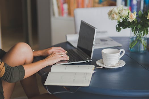 A person engaging in online learning at a coffee shop