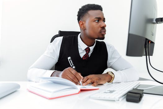 person writing in a planner