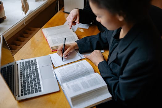 person reading with a notepad