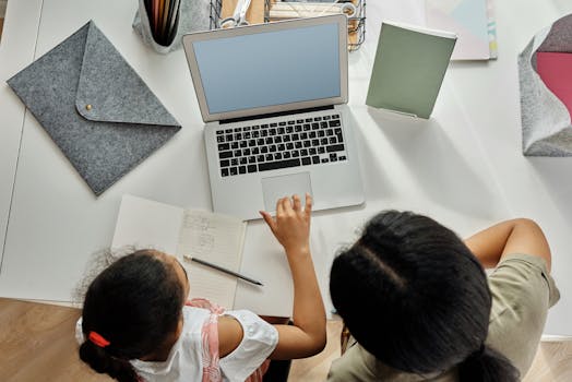 a person studying online with a laptop, showing technology in education