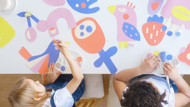 toddler painting at an art station