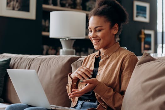 a person learning on a laptop in a cozy setting