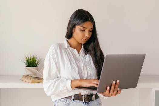 focused workspace with a computer and books