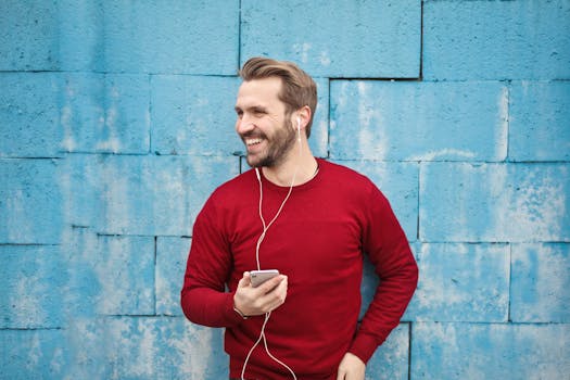 a person smiling while doing chores with music